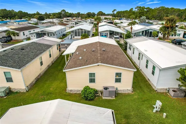 a aerial view of a house with a yard