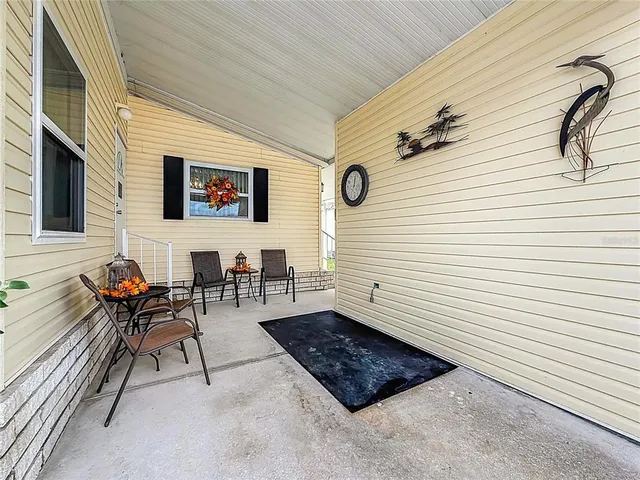 a view of a chairs and table in a balcony