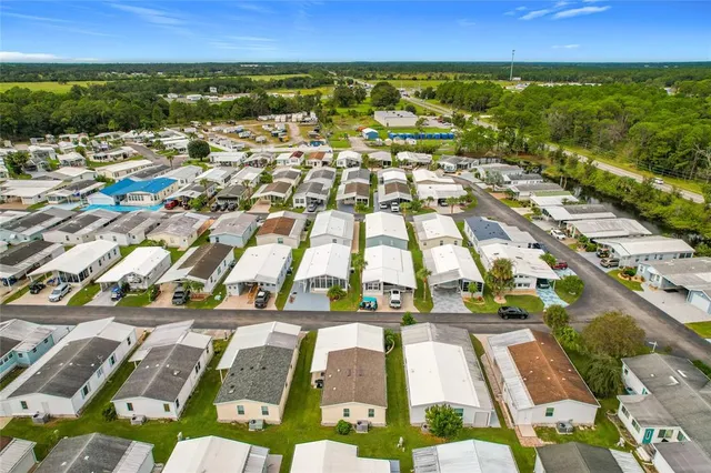 an aerial view of residential houses with outdoor space