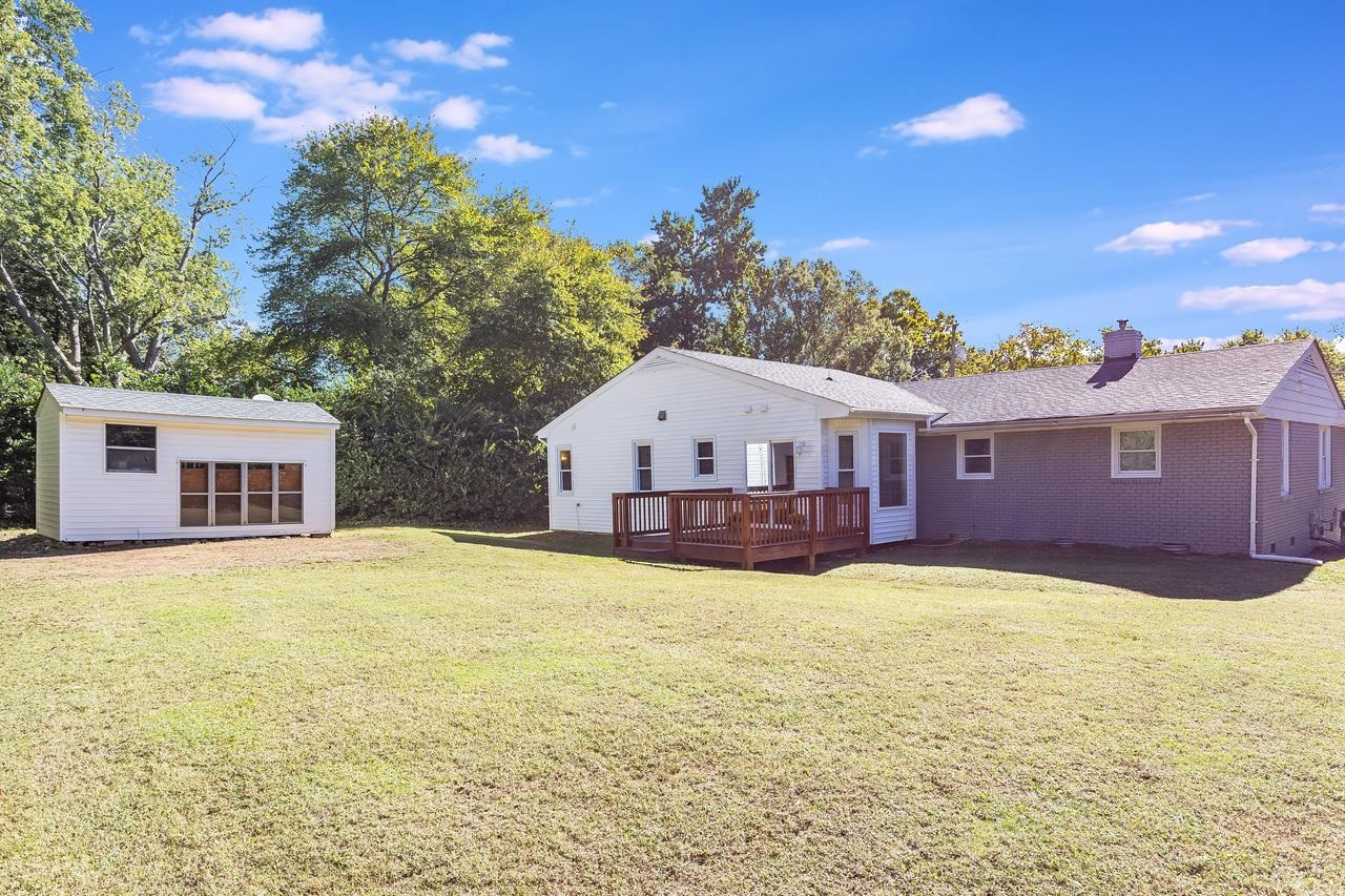5104 Newcastle Road Raleigh, NC 27606 - Photo 24 of 26 View of Storage Building & Rear of Home