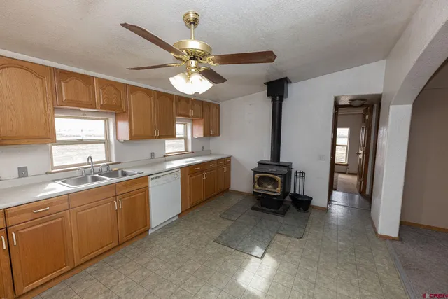a kitchen with a sink and wooden cabinets
