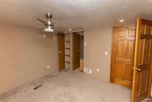 an empty room with closet area