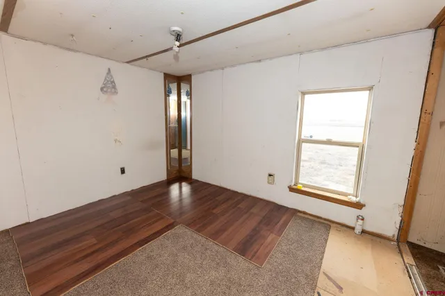 a view of an empty room and glass door