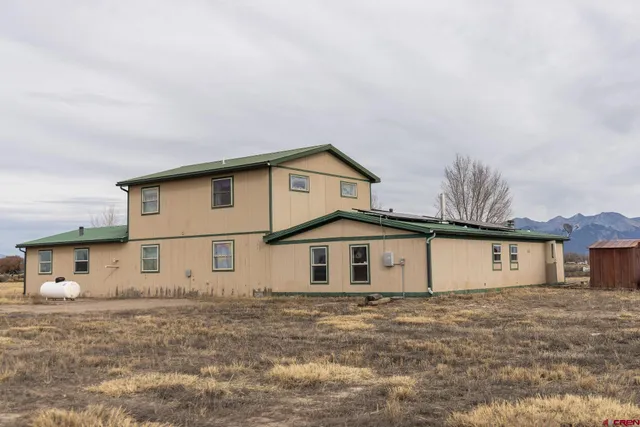 a view of a house with a big yard