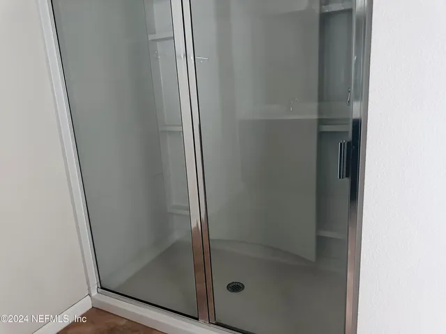 a bathroom with a glass door