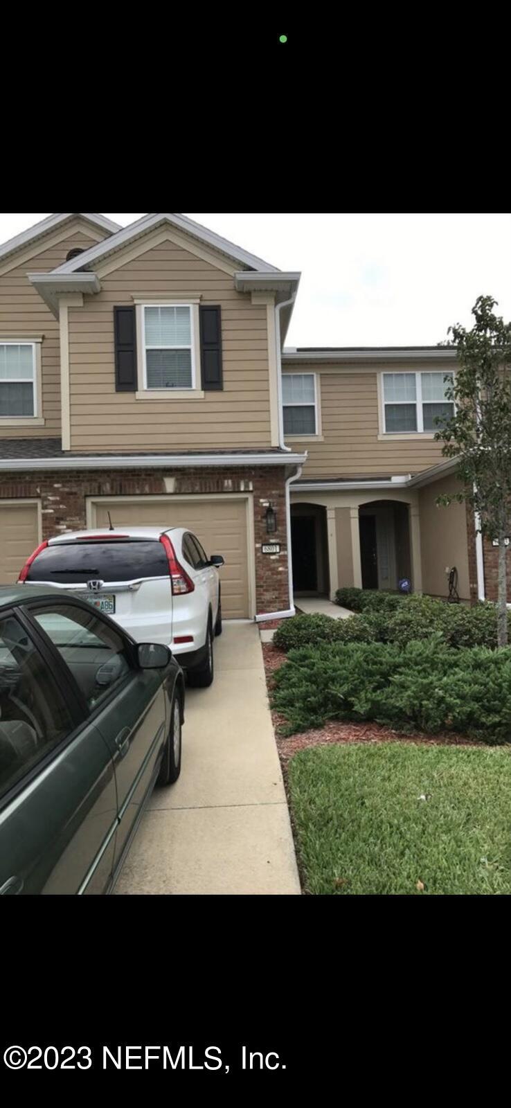 6801 Roundleaf Drive Jacksonville, FL 32258 - Photo 2 of 24 a front view of a house with a garden
