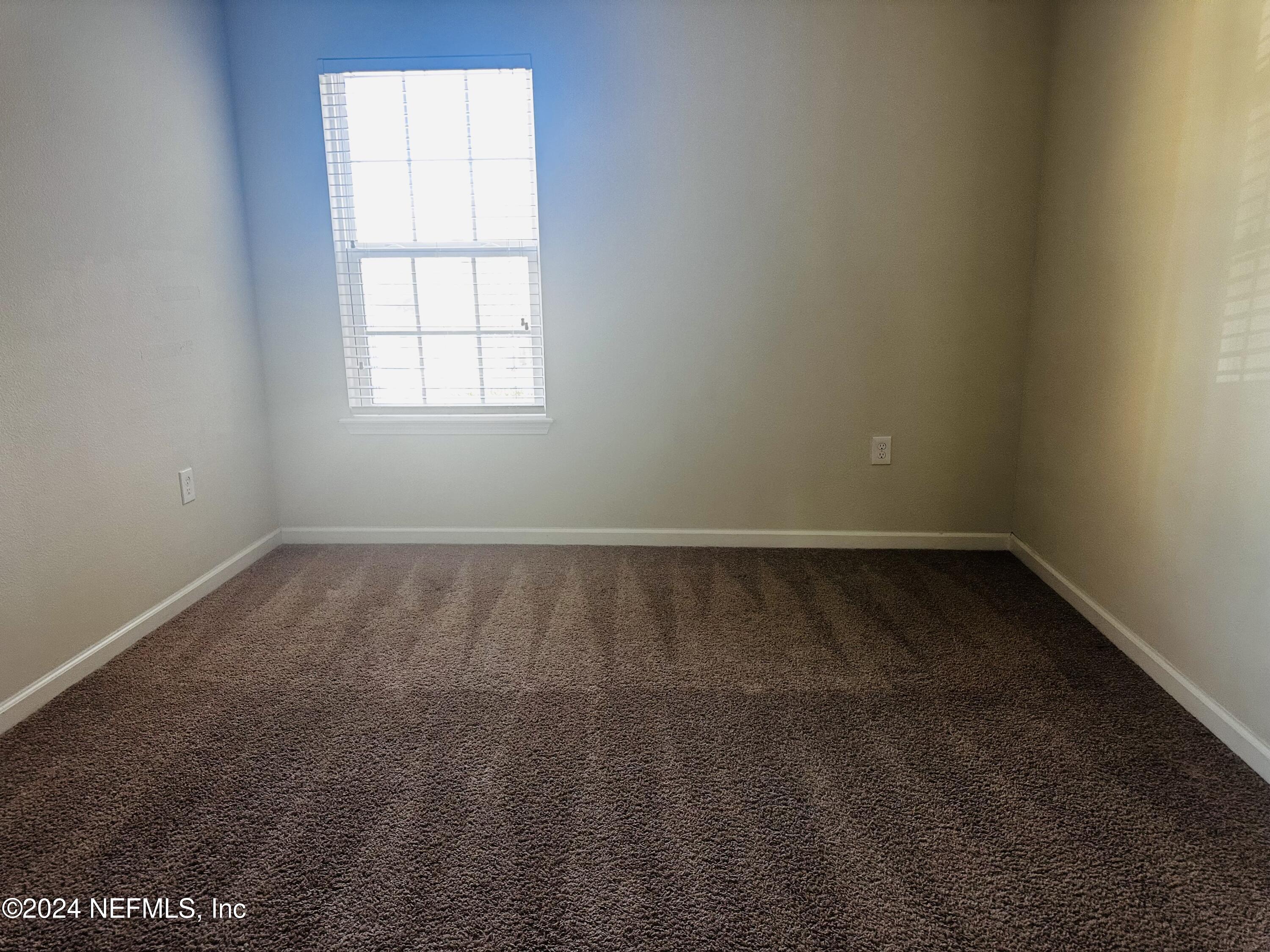 6801 Roundleaf Drive Jacksonville, FL 32258 - Photo 21 of 24 an empty room with a window