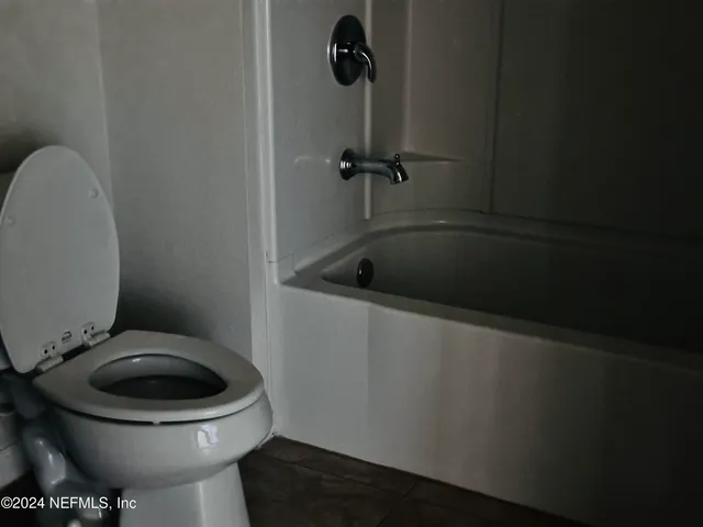 a bathroom with a toilet and a sink