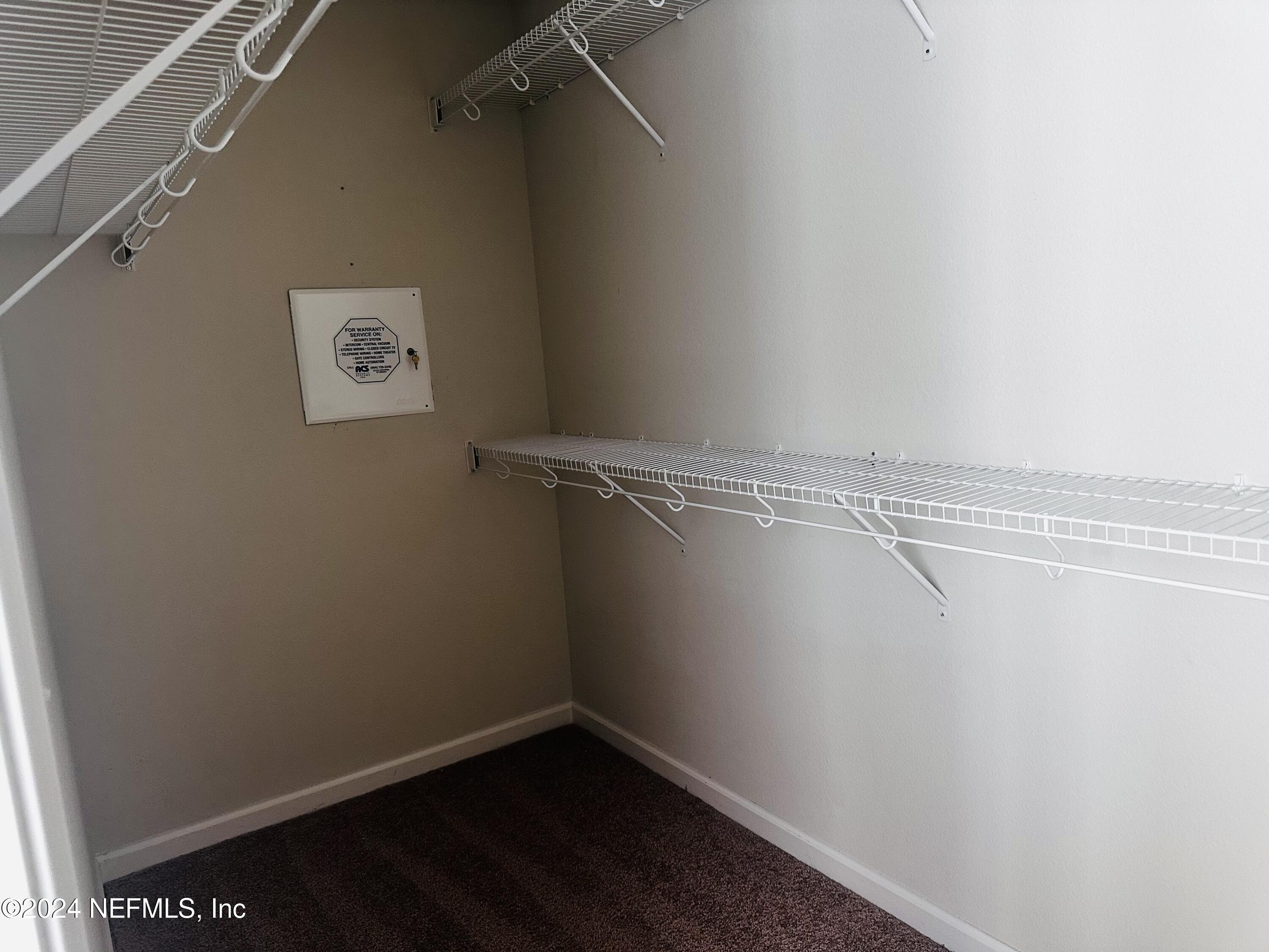 6801 Roundleaf Drive Jacksonville, FL 32258 - Photo 23 of 24 a view of a room with racks on the wall