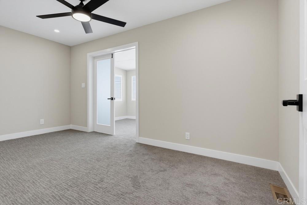650 South Rancho Santa Fe Road, Unit 52 San Marcos, CA 92078 - Photo 12 of 22 Nice size room. This room leads out to the enclosed patio room.