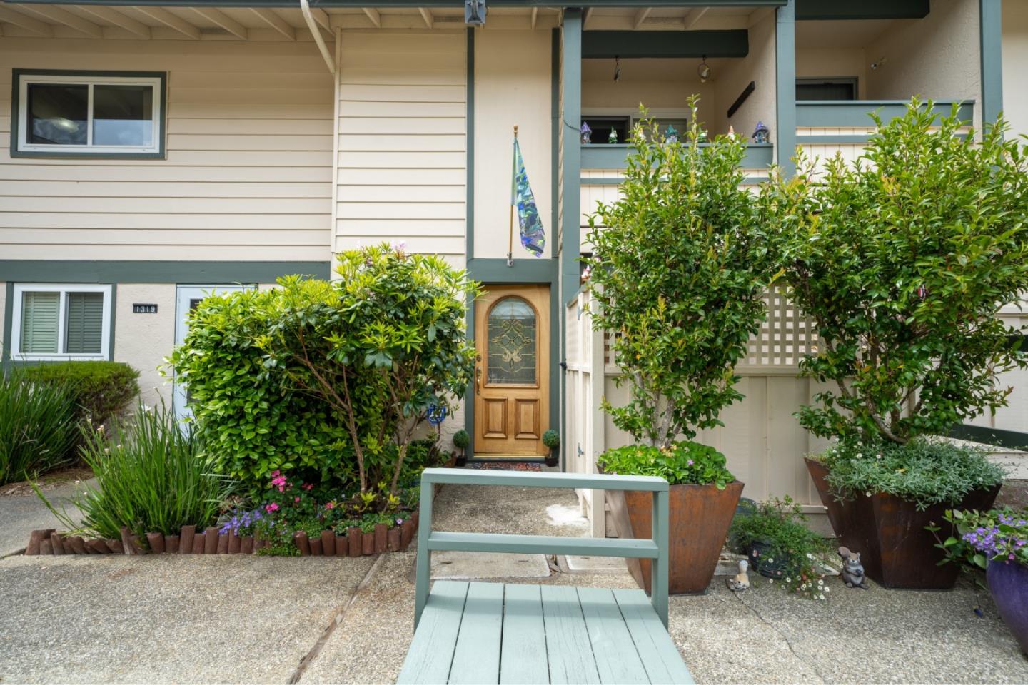 a front view of a house with garden