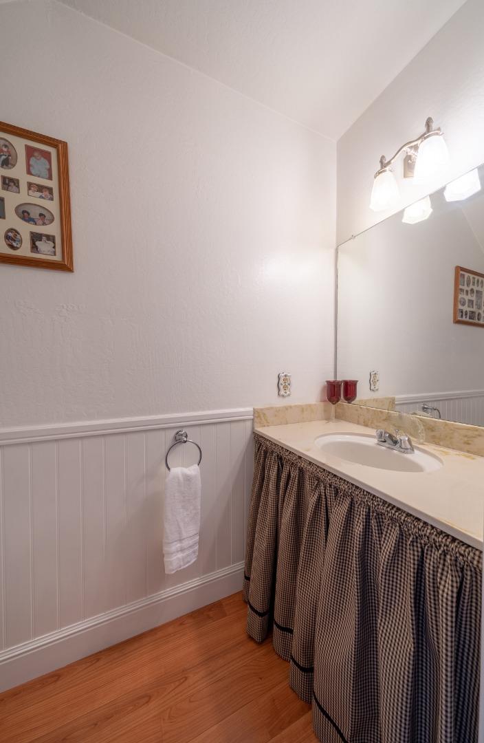 1321 Terra Nova Boulevard Pacifica, CA 94044 - Photo 18 of 39 a bathroom with a sink and mirror