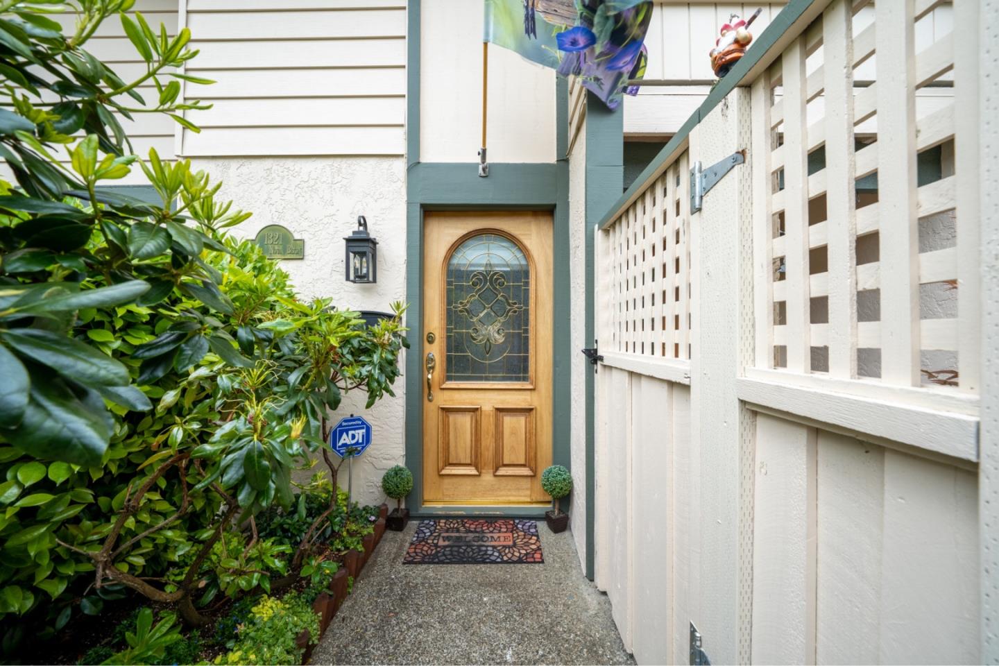 1321 Terra Nova Boulevard Pacifica, CA 94044 - Photo 2 of 39 a view of a brick house with a large door and windows