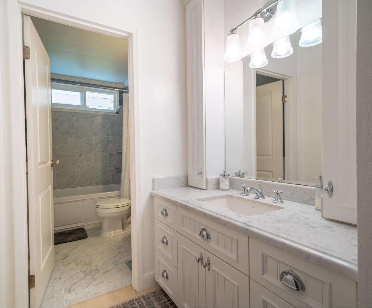 1321 Terra Nova Boulevard Pacifica, CA 94044 - Photo 34 of 39 a bathroom with a sink a toilet and shower
