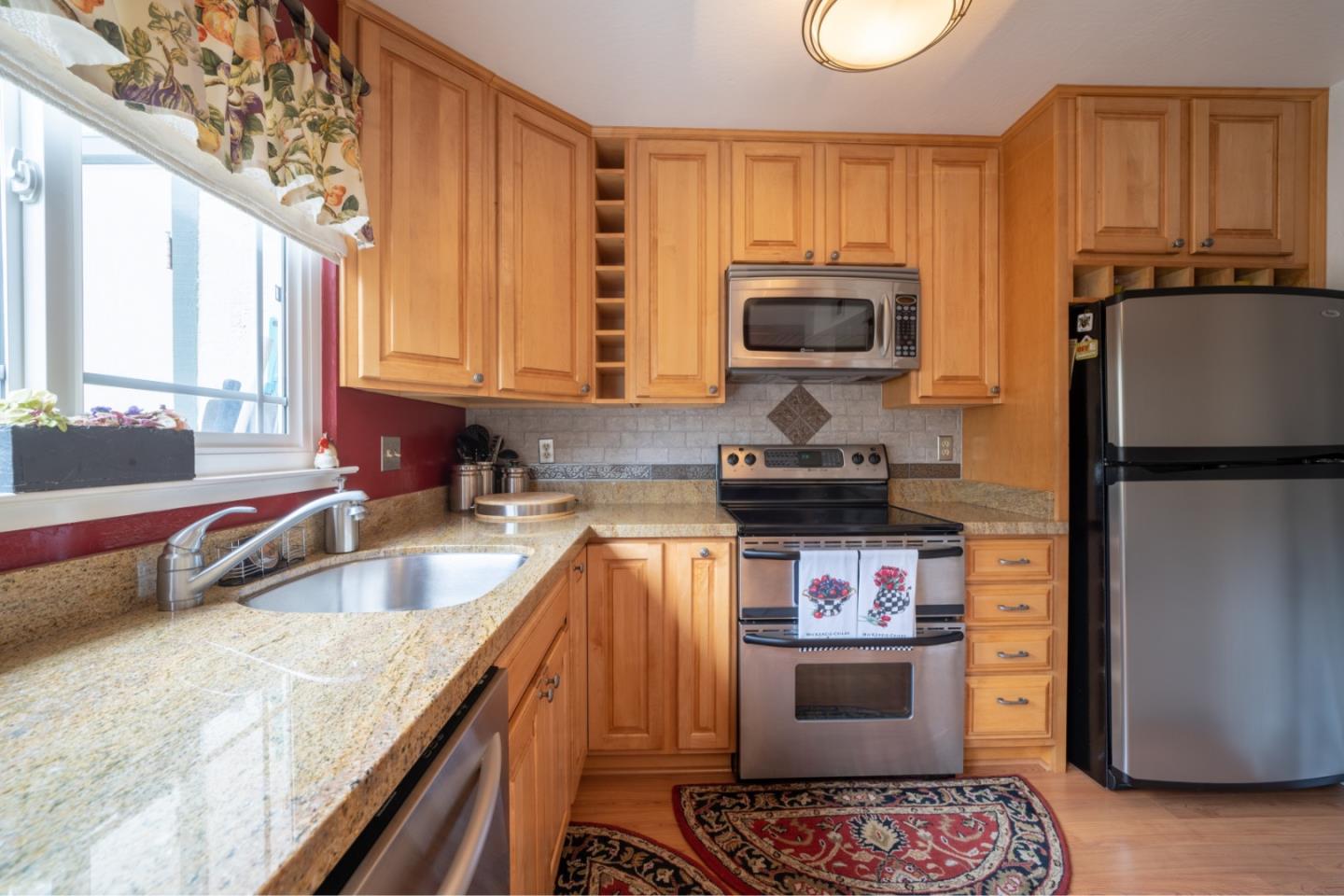1321 Terra Nova Boulevard Pacifica, CA 94044 - Photo 7 of 39 a kitchen with a stove and a refrigerator