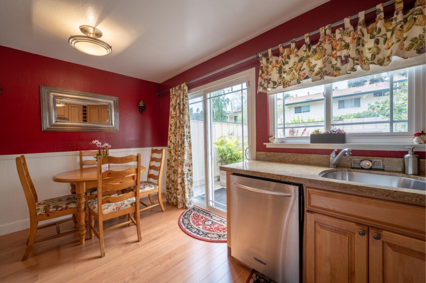 1321 Terra Nova Boulevard Pacifica, CA 94044 - Photo 8 of 39 a kitchen with a table chairs and wooden floor