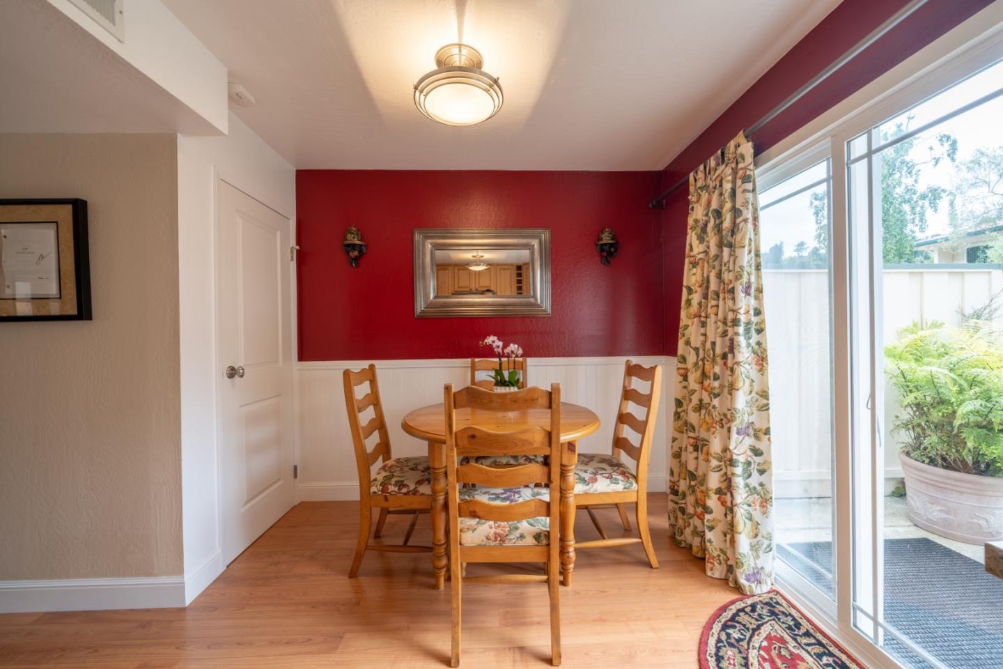 1321 Terra Nova Boulevard Pacifica, CA 94044 - Photo 9 of 39 a view of a dining room with furniture window and wooden floor