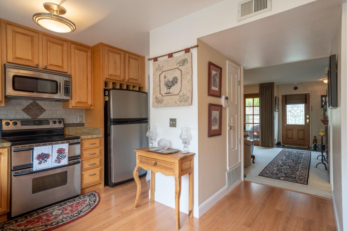 1321 Terra Nova Boulevard Pacifica, CA 94044 - Photo 10 of 39 a kitchen with stainless steel appliances granite countertop a refrigerator stove and sink