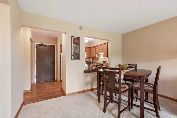a view of a dining room with furniture and a livingroom