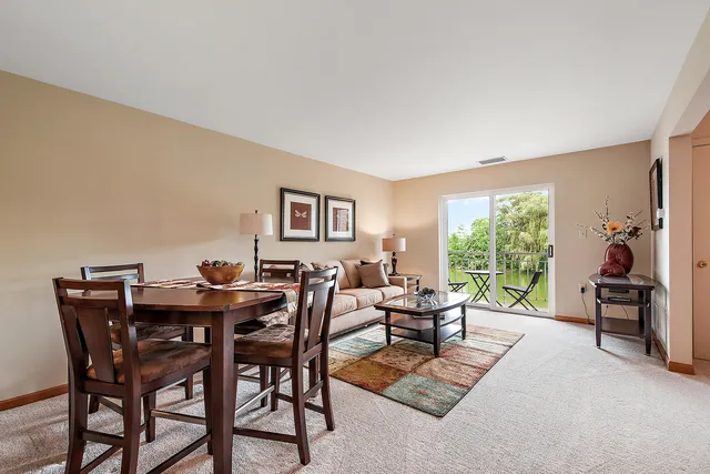 a view of a livingroom with furniture and a window