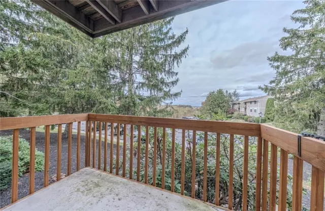 a balcony with wooden floor