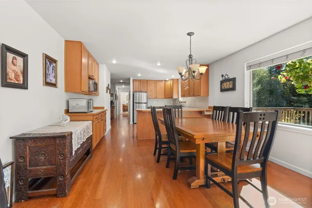 a dining room with furniture and window