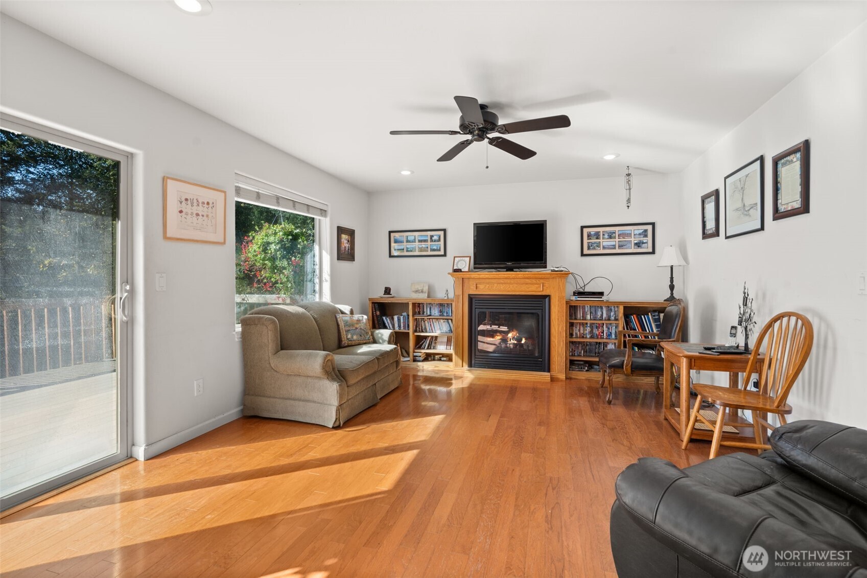 27 Otter Lane Elma, WA 98541 - Photo 12 of 31 a living room with furniture a fireplace and a flat screen tv