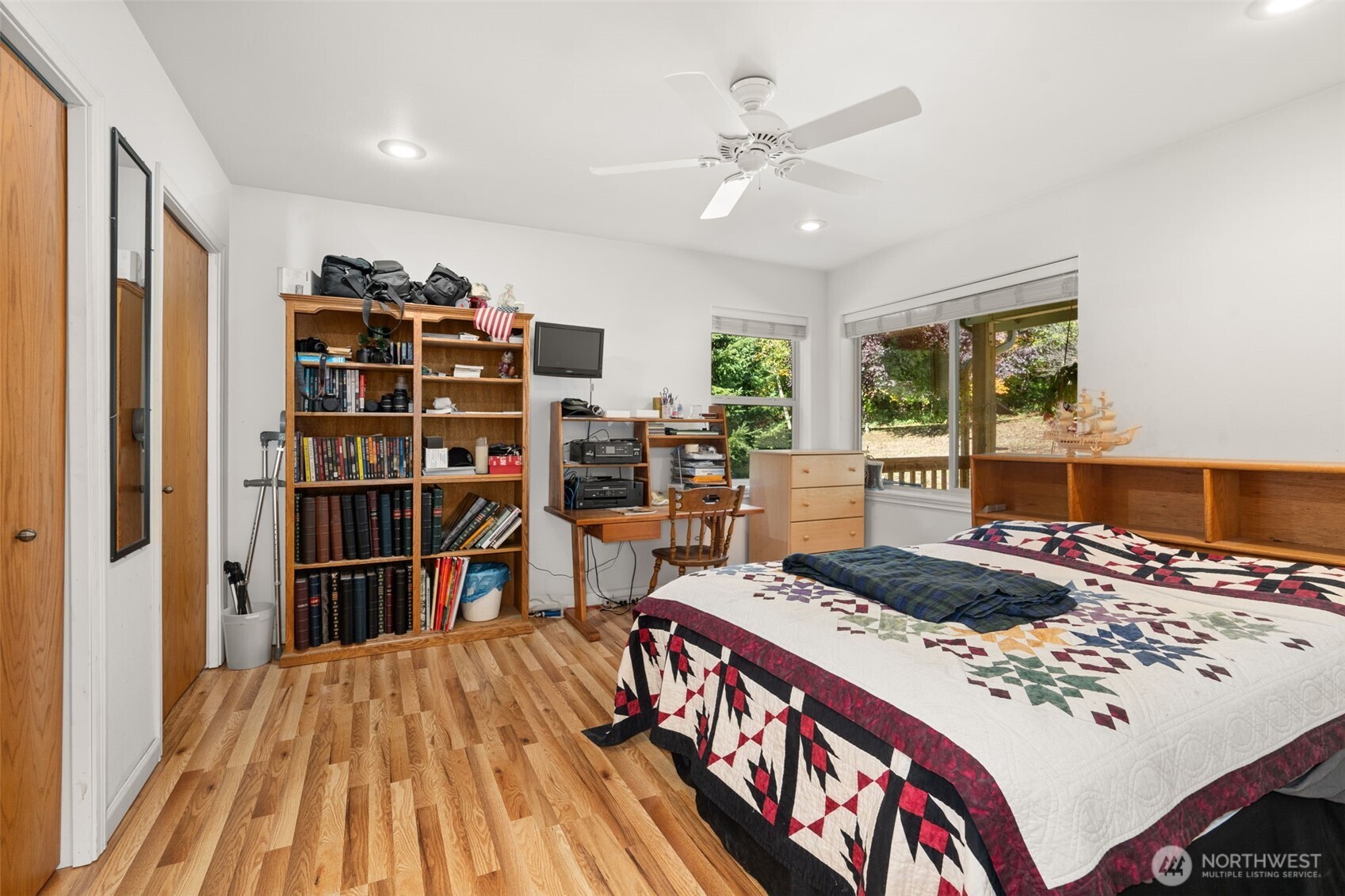 27 Otter Lane Elma, WA 98541 - Photo 13 of 31 a bed room with a bed and a book shelf