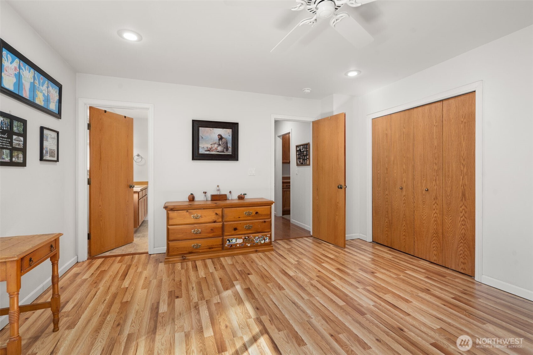 27 Otter Lane Elma, WA 98541 - Photo 20 of 31 a bedroom with a bed and a chandelier