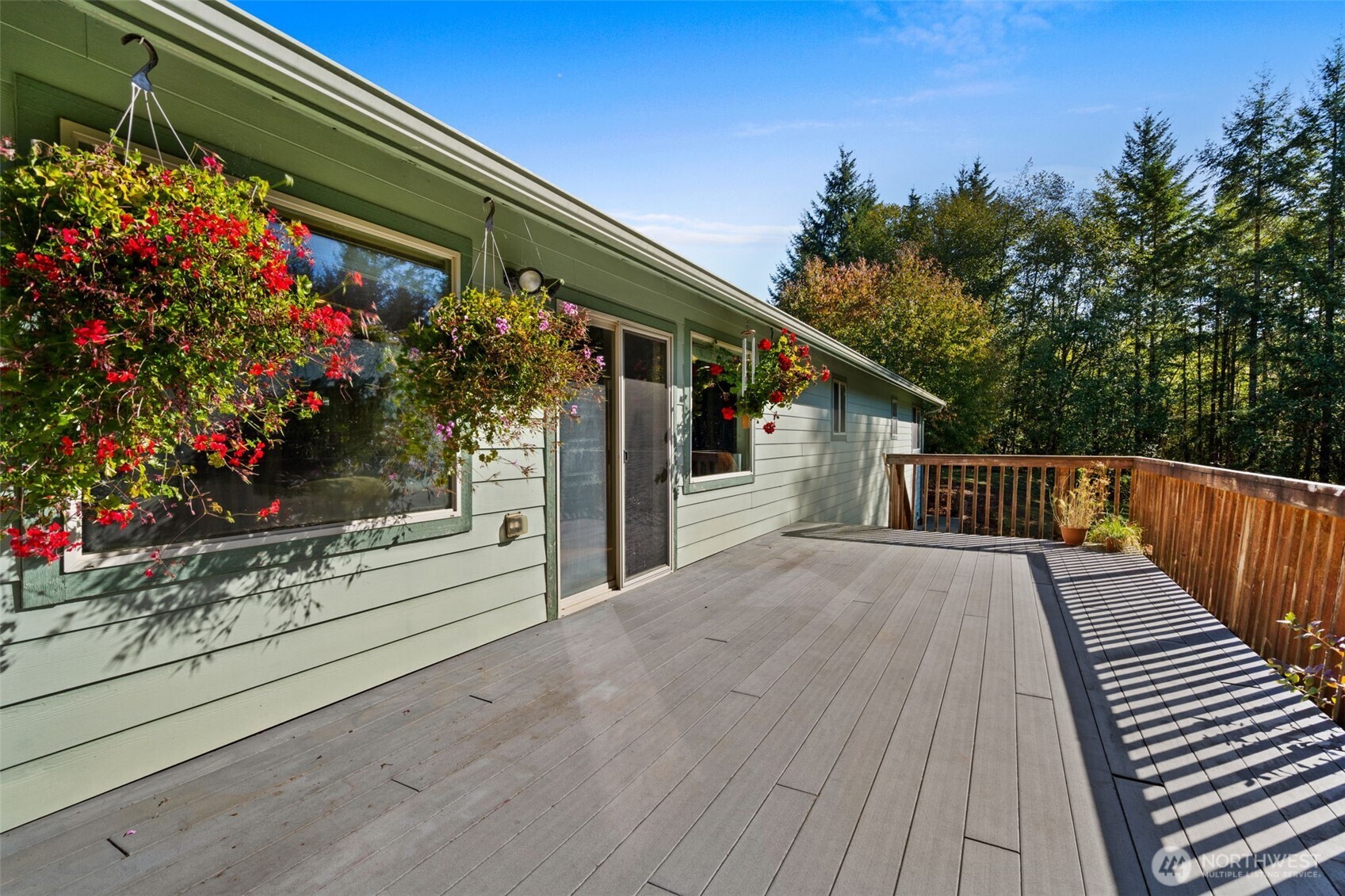27 Otter Lane Elma, WA 98541 - Photo 22 of 31 a balcony with flowers and wooden floor
