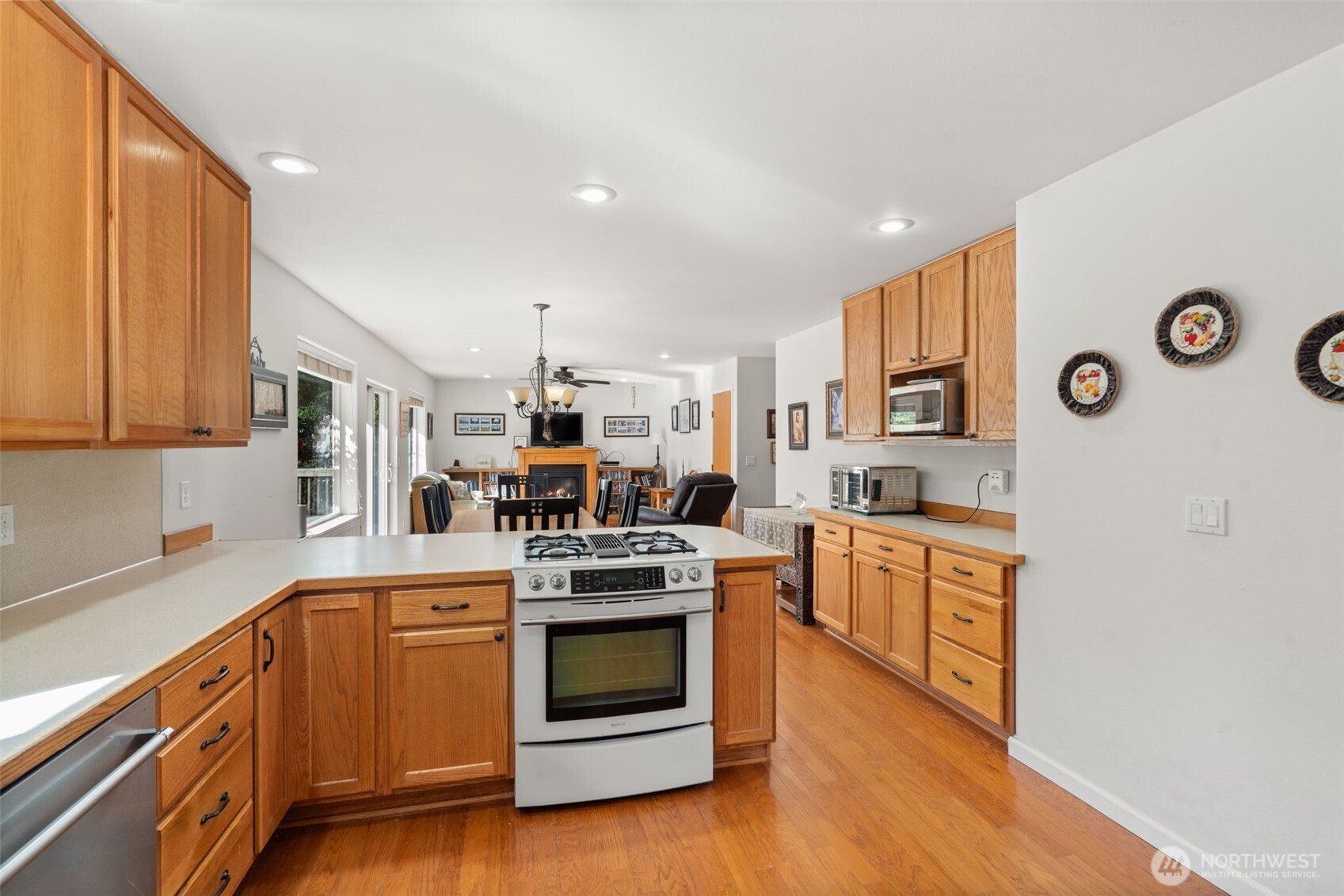 27 Otter Lane Elma, WA 98541 - Photo 8 of 31 a kitchen with stainless steel appliances granite countertop a stove and a refrigerator