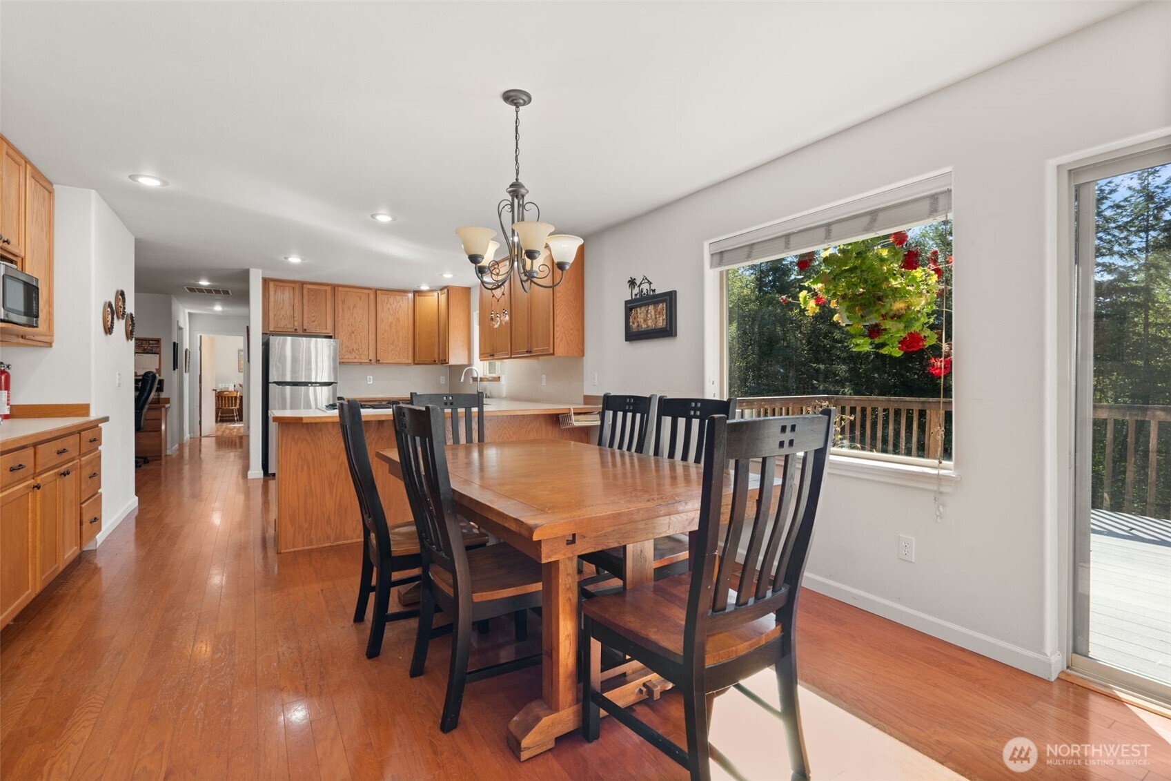 27 Otter Lane Elma, WA 98541 - Photo 10 of 31 a dining room with furniture a chandelier and wooden floor