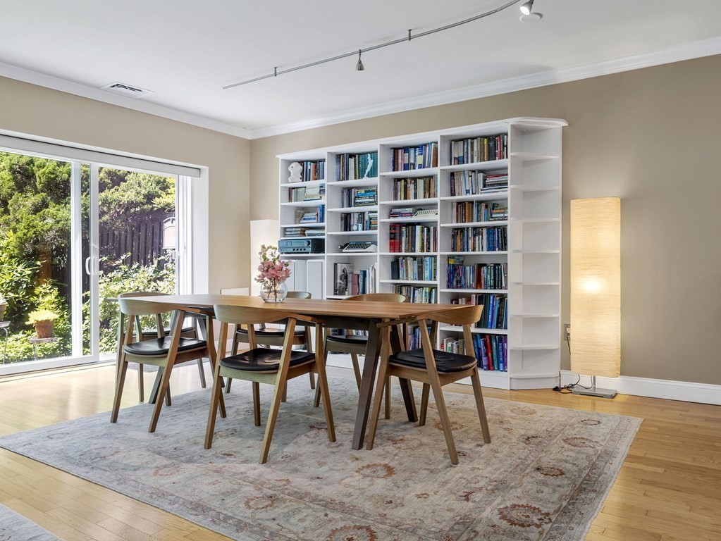 64 Ober Road, Unit 64 Newton, MA 02459 - Photo 8 of 26 a dining room with a wooden table and chairs