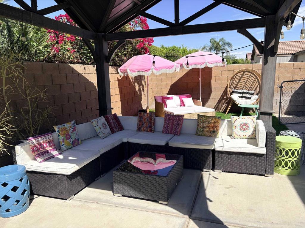 80596 Key Largo Avenue Indio, CA 92201 - Photo 30 of 59 a outdoor space with patio the couches and a potted plant