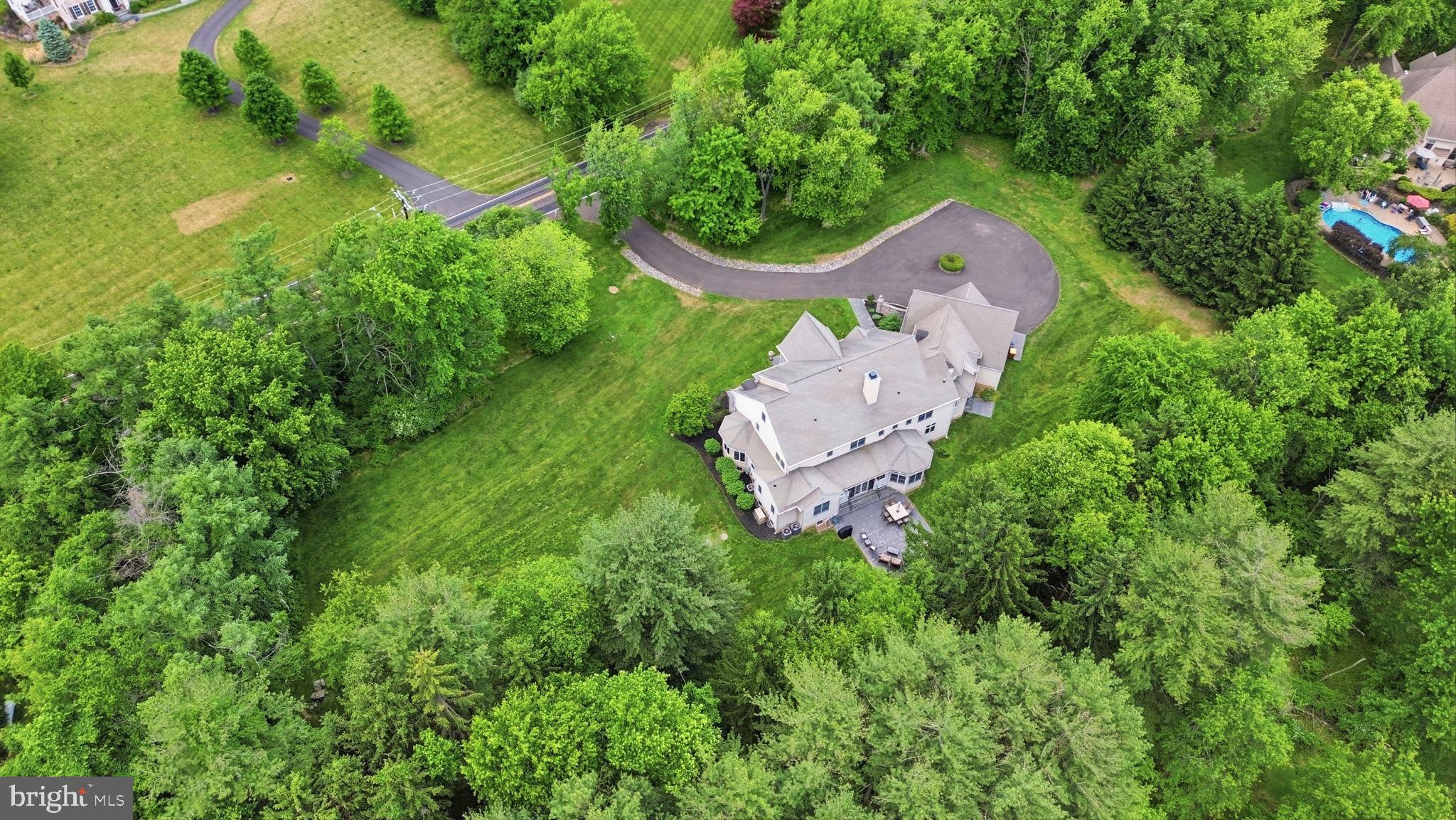 1588 Wrightstown Road Newtown, PA 18940 - Photo 80 of 81 an aerial view of a house with a yard basket ball court and outdoor seating