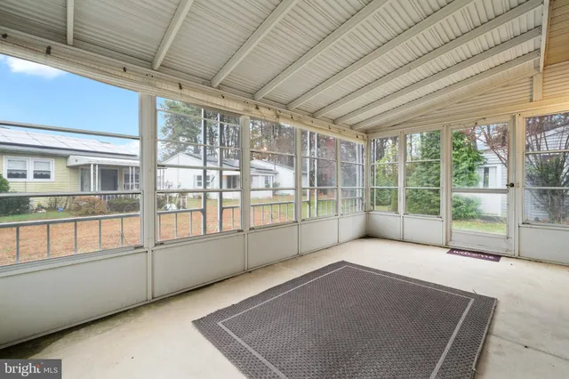 a view of an empty room with a balcony