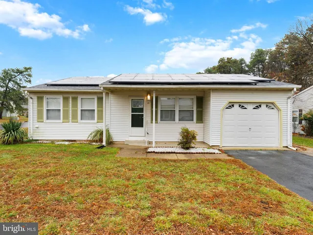 a house that has a big yard in front of it