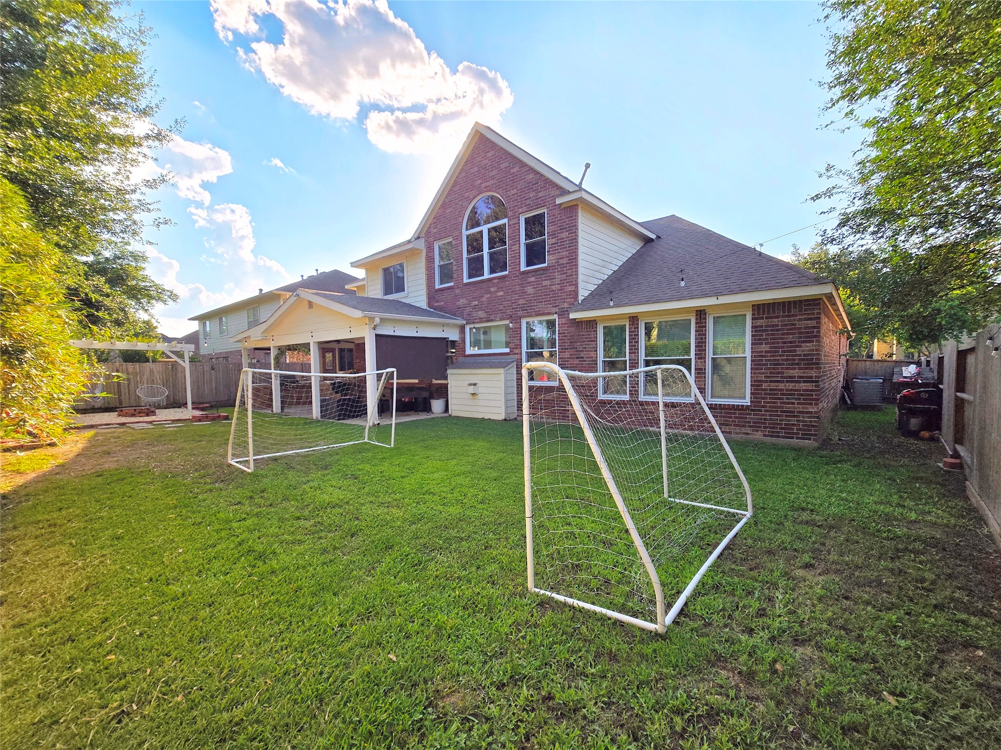 9211 Memorial Grove Drive Spring, TX 77379 - Photo 6 of 38 a view of a house with a backyard