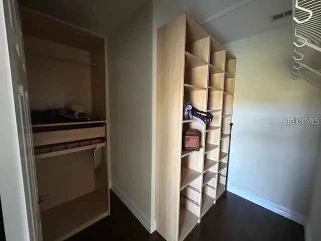 a kitchen with a refrigerator and cabinets