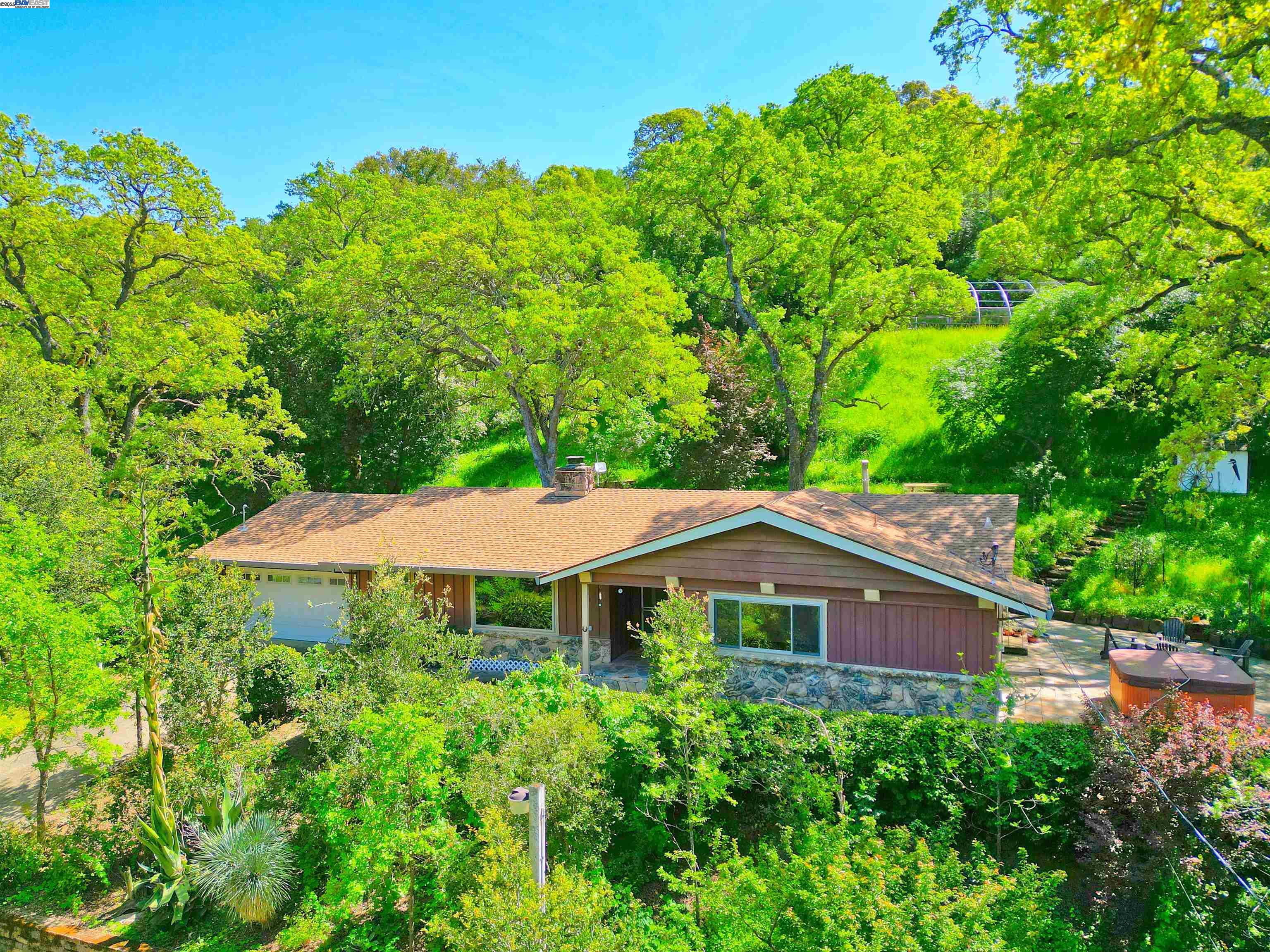 5070 Morgan Territory Road Clayton, CA 94517 - Photo 1 of 1 a front view of a house with a yard and trees