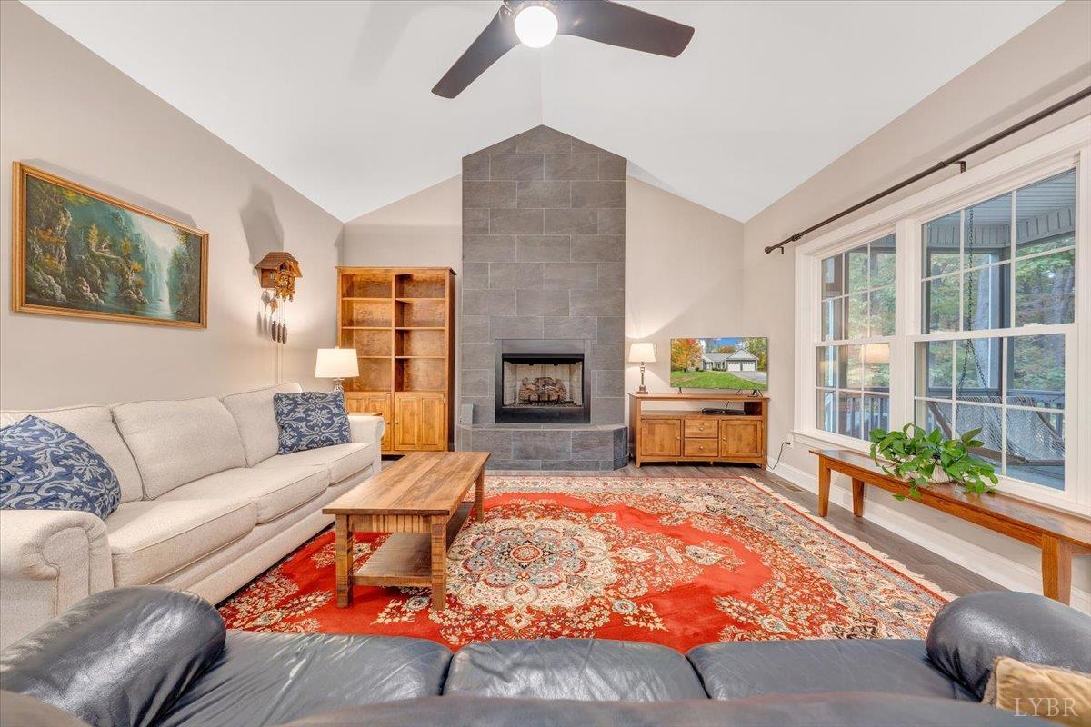 111 Otterview Road Forest, VA 24551 - Photo 12 of 55 a living room with furniture and a fireplace