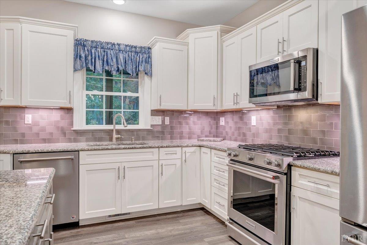 111 Otterview Road Forest, VA 24551 - Photo 17 of 55 a kitchen with cabinets appliances and a sink