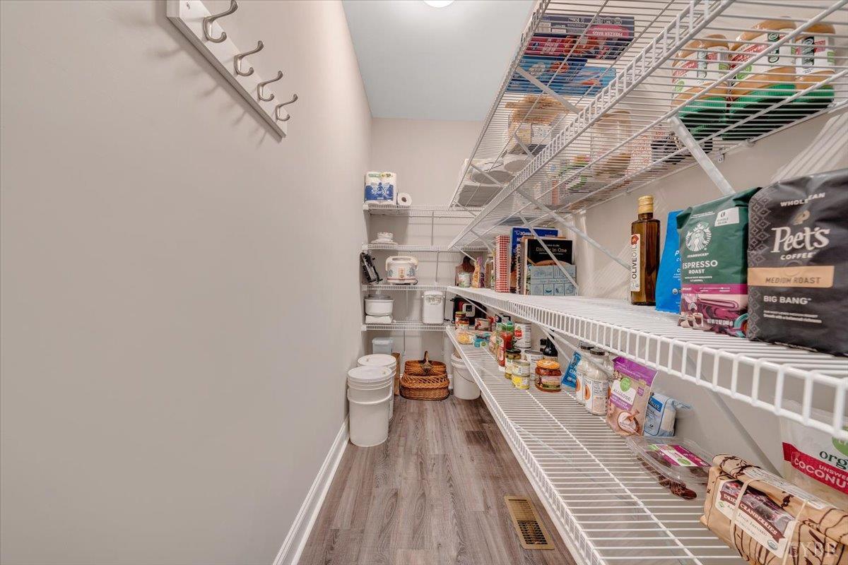 111 Otterview Road Forest, VA 24551 - Photo 19 of 55 a view of staircase with lots of frames on wall and a chandelier