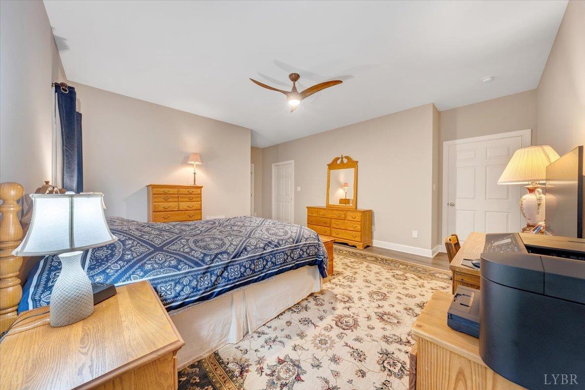 111 Otterview Road Forest, VA 24551 - Photo 21 of 55 a bedroom with a bed and wooden floor