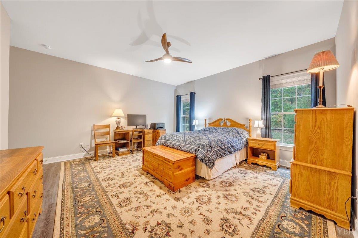 111 Otterview Road Forest, VA 24551 - Photo 22 of 55 a bedroom with a bed and wooden floor