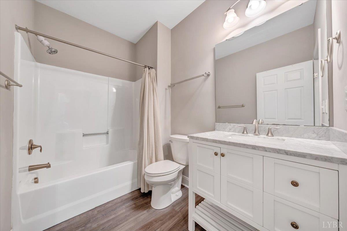 111 Otterview Road Forest, VA 24551 - Photo 30 of 55 a bathroom with a sink toilet a shower and a mirror