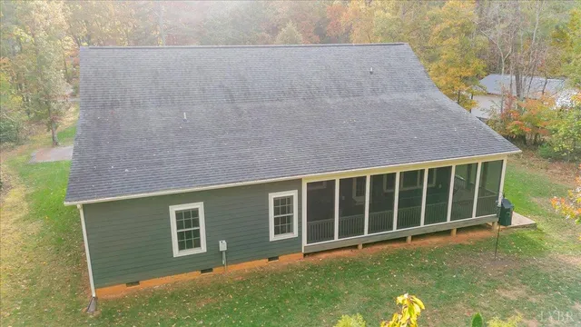 a view of a house with a yard and garage