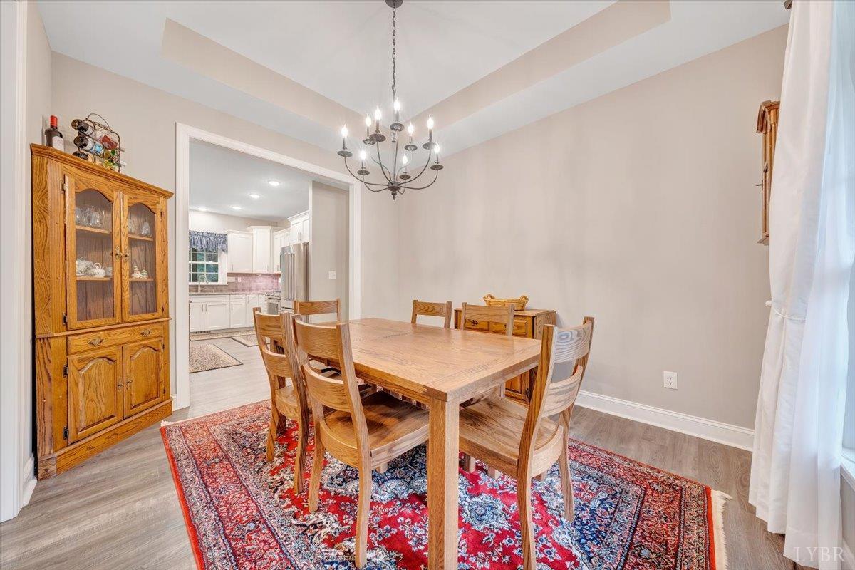111 Otterview Road Forest, VA 24551 - Photo 9 of 55 a view of a dining room with furniture and chandelier