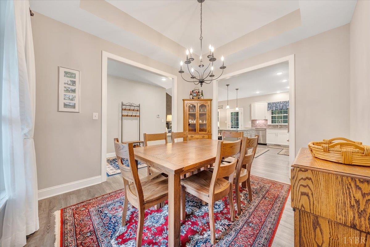 111 Otterview Road Forest, VA 24551 - Photo 10 of 55 a view of a dining room with furniture and wooden floor