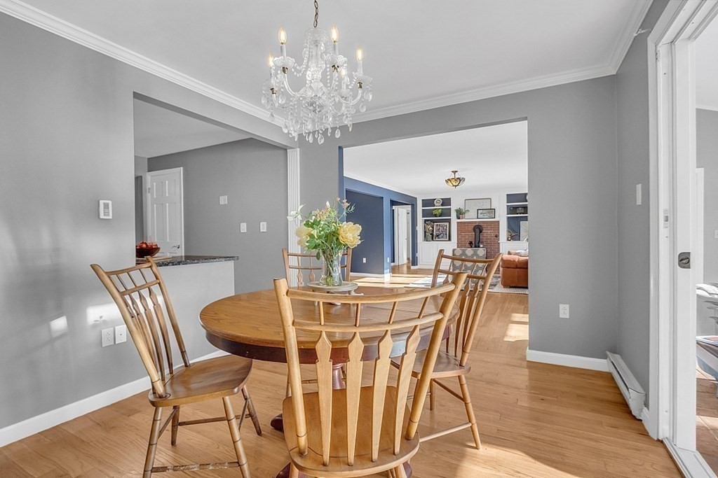 105 Secret Lake Road Phillipston, MA 01331 - Photo 16 of 42 a view of a dining room with furniture and chandelier